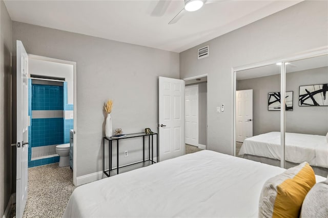 bedroom with ensuite bath and ceiling fan