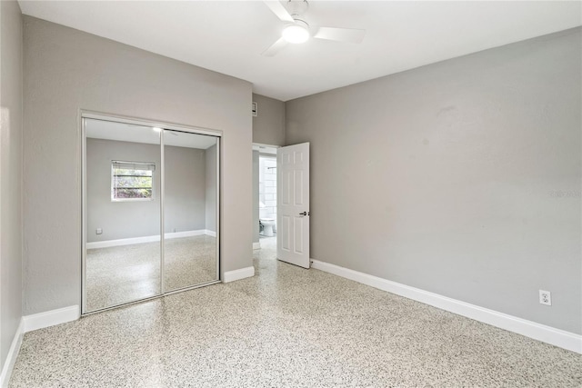 unfurnished bedroom with a closet and ceiling fan