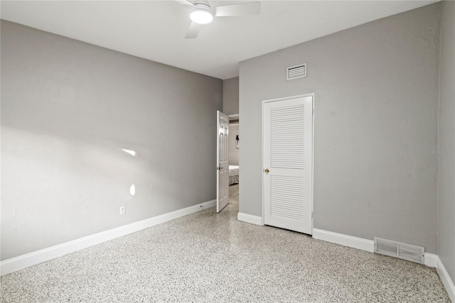 unfurnished bedroom with a closet and ceiling fan