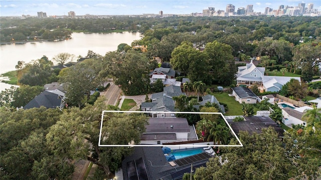 birds eye view of property with a water view