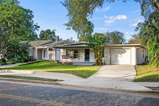 ranch-style house with a front lawn, a porch, and a garage