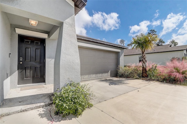 entrance to property featuring a garage