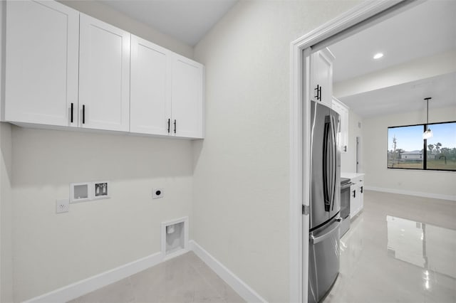 laundry room featuring washer hookup, cabinets, and hookup for an electric dryer