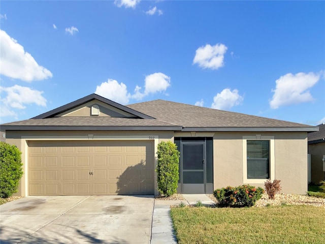 single story home with a front yard and a garage