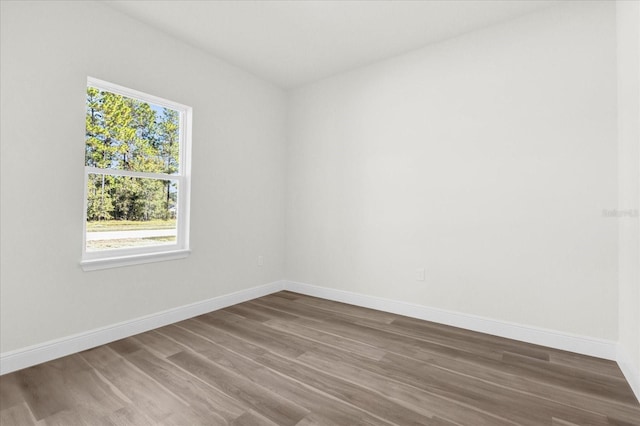 spare room with wood-type flooring