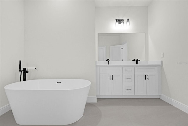 bathroom with a tub to relax in and vanity