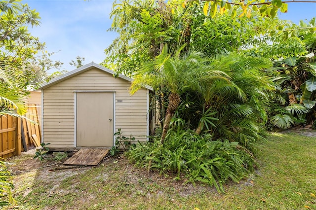 view of outdoor structure featuring a lawn