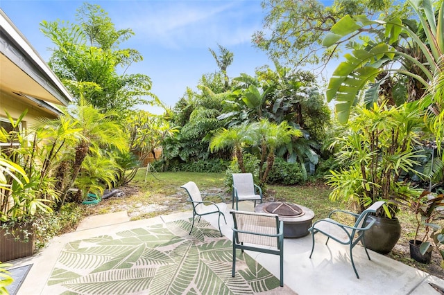 view of patio with a fire pit