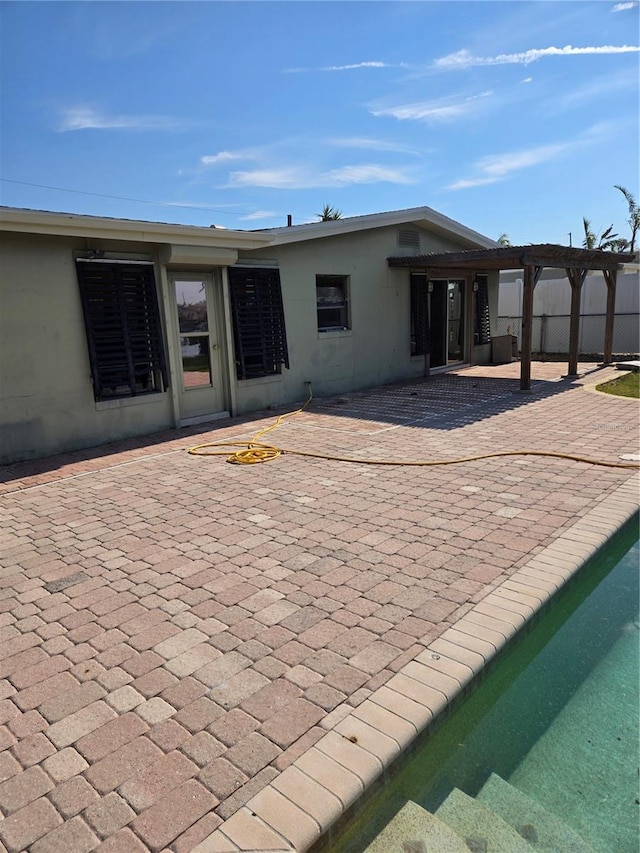 rear view of house with a patio