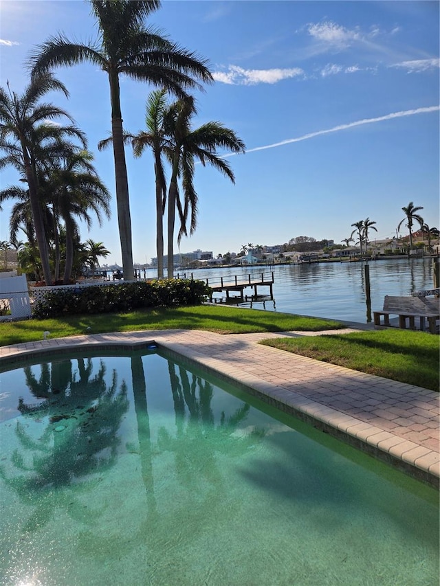 view of swimming pool with a water view