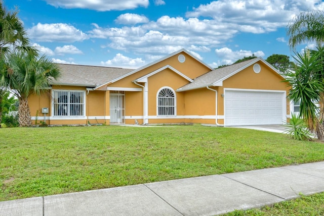 ranch-style home featuring a garage and a front lawn