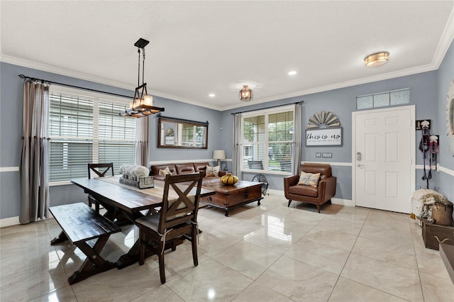 dining area with crown molding, a notable chandelier, and light tile patterned flooring