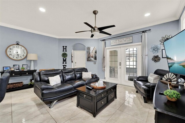 living room with ornamental molding, french doors, and ceiling fan