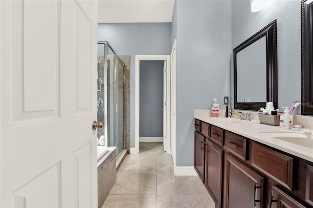 bathroom with vanity and an enclosed shower