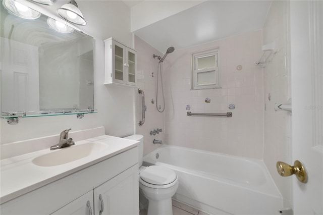 full bathroom featuring toilet, tiled shower / bath combo, vanity, and tile patterned floors