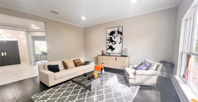 living room with dark hardwood / wood-style floors and crown molding