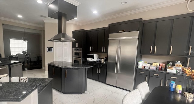 kitchen featuring island exhaust hood, stainless steel appliances, dark stone countertops, a center island, and hanging light fixtures