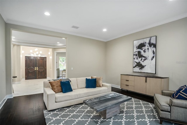 living room featuring dark hardwood / wood-style floors and crown molding