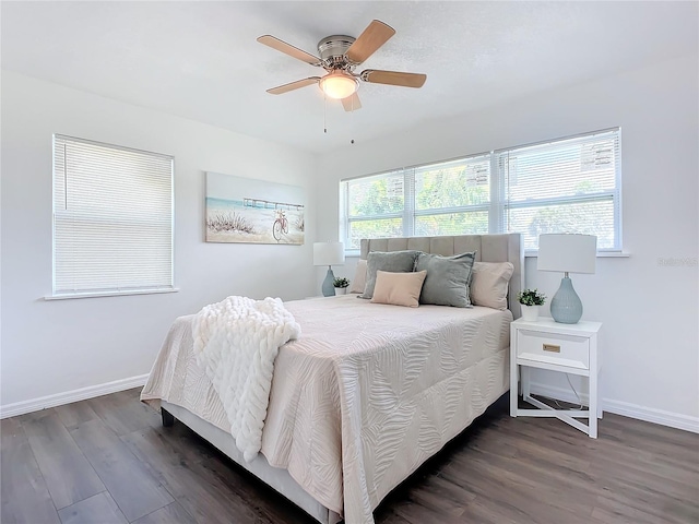 bedroom featuring ceiling fan and dark hardwood / wood-style floors