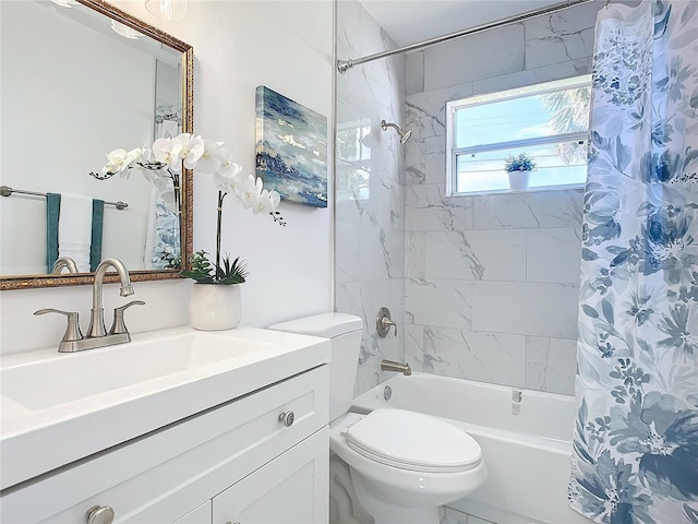 full bathroom featuring toilet, shower / bath combo, and vanity