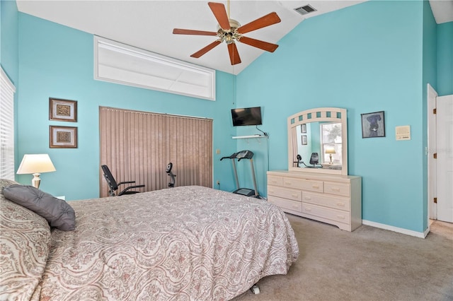 bedroom with light colored carpet, high vaulted ceiling, and ceiling fan