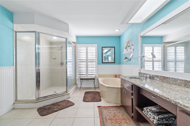 bathroom with vanity, tile patterned floors, a wealth of natural light, and shower with separate bathtub