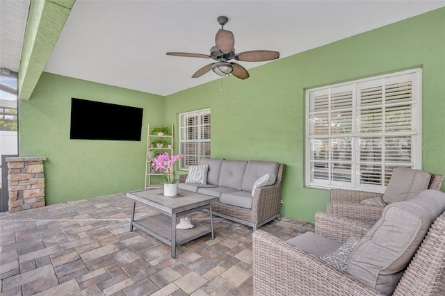 view of patio / terrace with an outdoor living space and ceiling fan