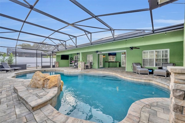 view of pool featuring a patio, ceiling fan, and a fenced in pool