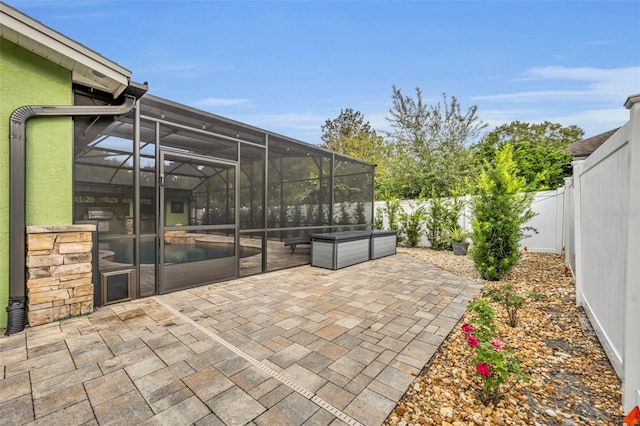 view of patio with a lanai