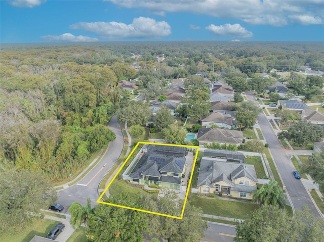 birds eye view of property featuring a residential view and a forest view