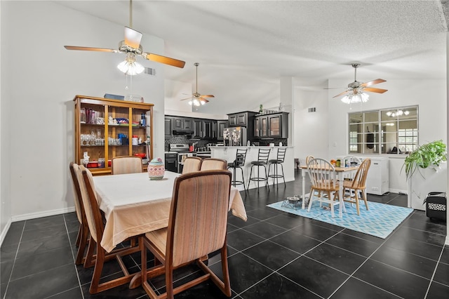 tiled dining room featuring high vaulted ceiling and a textured ceiling