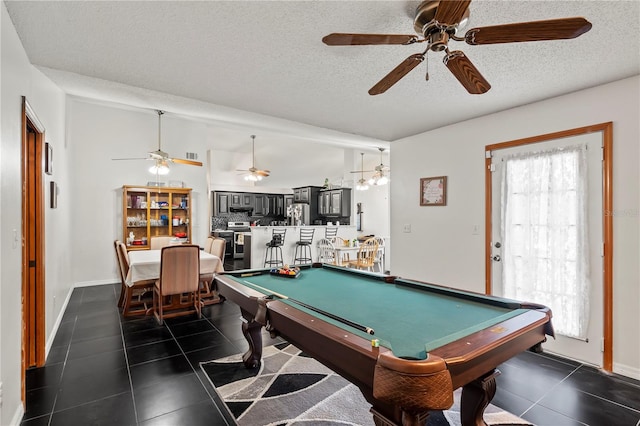 playroom featuring a textured ceiling, billiards, dark tile patterned floors, and ceiling fan