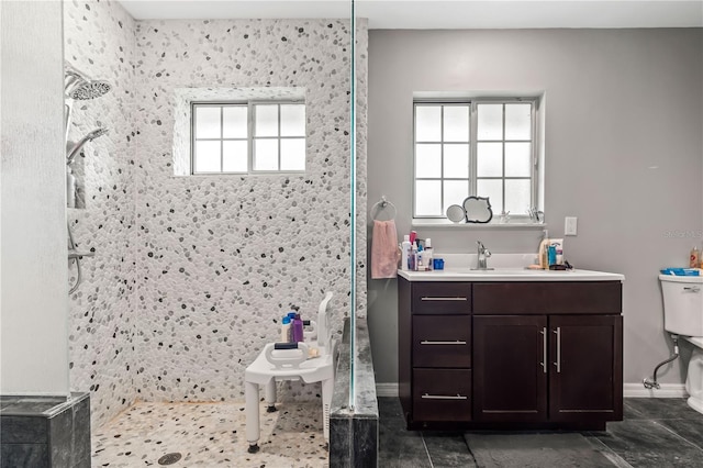 bathroom featuring vanity and tiled shower