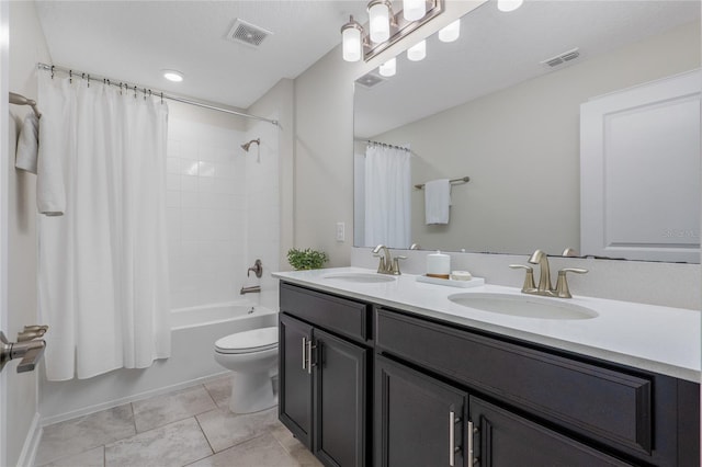 full bathroom with shower / bathtub combination with curtain, tile patterned flooring, vanity, a textured ceiling, and toilet