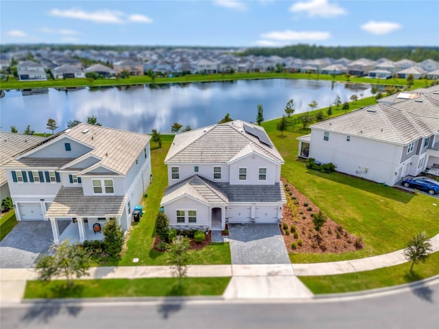 bird's eye view featuring a water view and a residential view