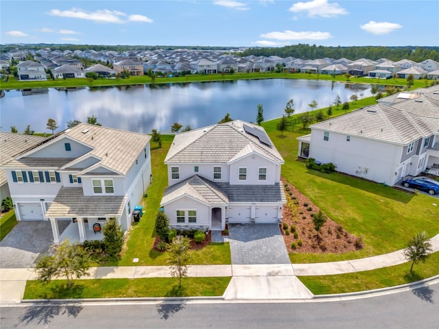 bird's eye view featuring a residential view and a water view