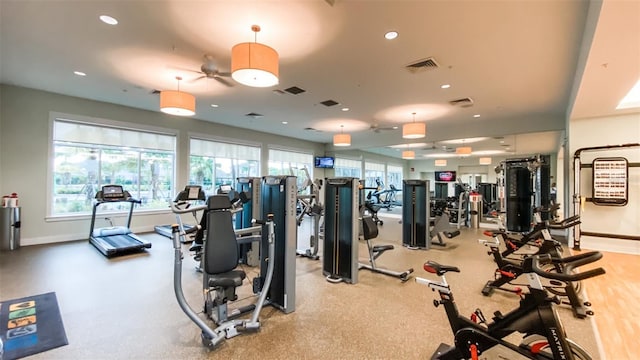 gym featuring baseboards, visible vents, and recessed lighting