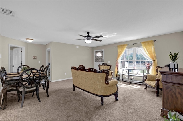 carpeted living room featuring ceiling fan