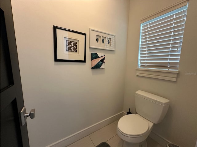 bathroom featuring toilet and tile patterned floors