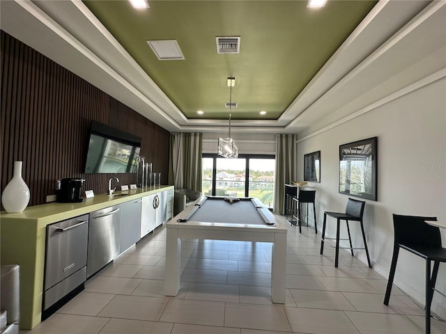 game room with pool table, light tile patterned floors, and a raised ceiling