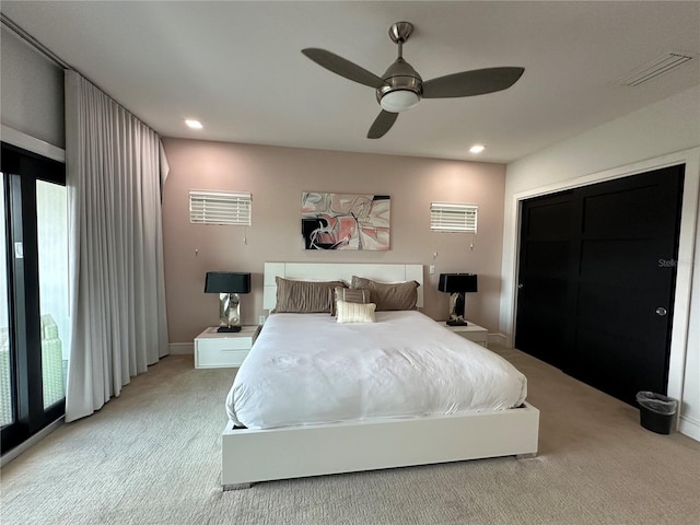 carpeted bedroom featuring ceiling fan and access to exterior