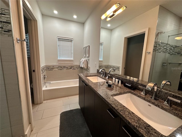 bathroom with vanity, tile patterned floors, and separate shower and tub