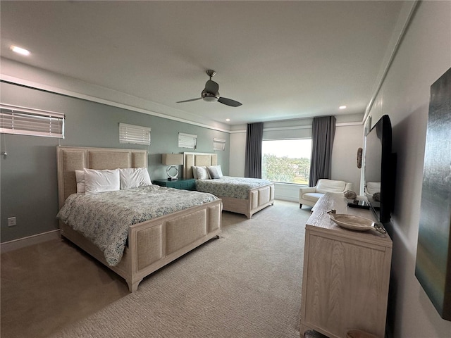 bedroom featuring ornamental molding, light carpet, and ceiling fan