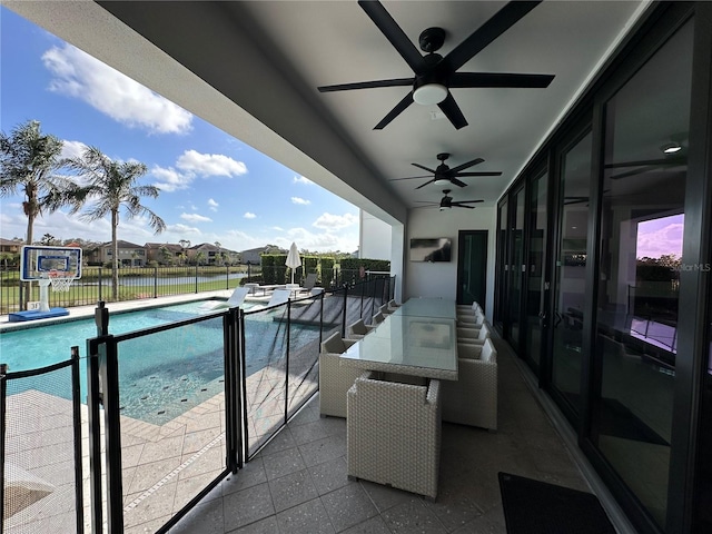 balcony featuring a patio area and ceiling fan