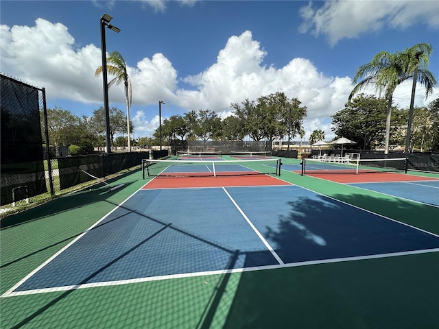 view of sport court with basketball hoop