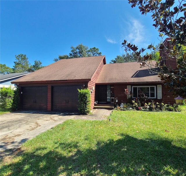 single story home with a front yard and a garage