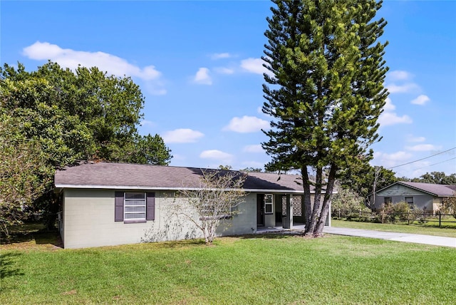 ranch-style house with a front lawn