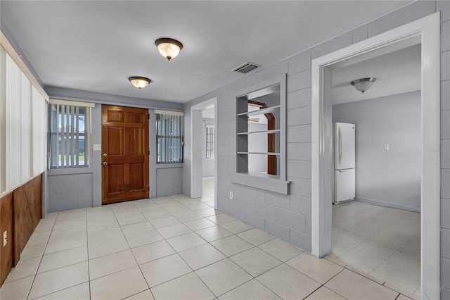 entrance foyer with light tile patterned flooring