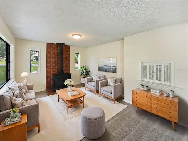 living room with a textured ceiling and a healthy amount of sunlight