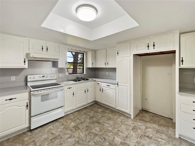 kitchen with sink, white electric range, white cabinets, and a raised ceiling